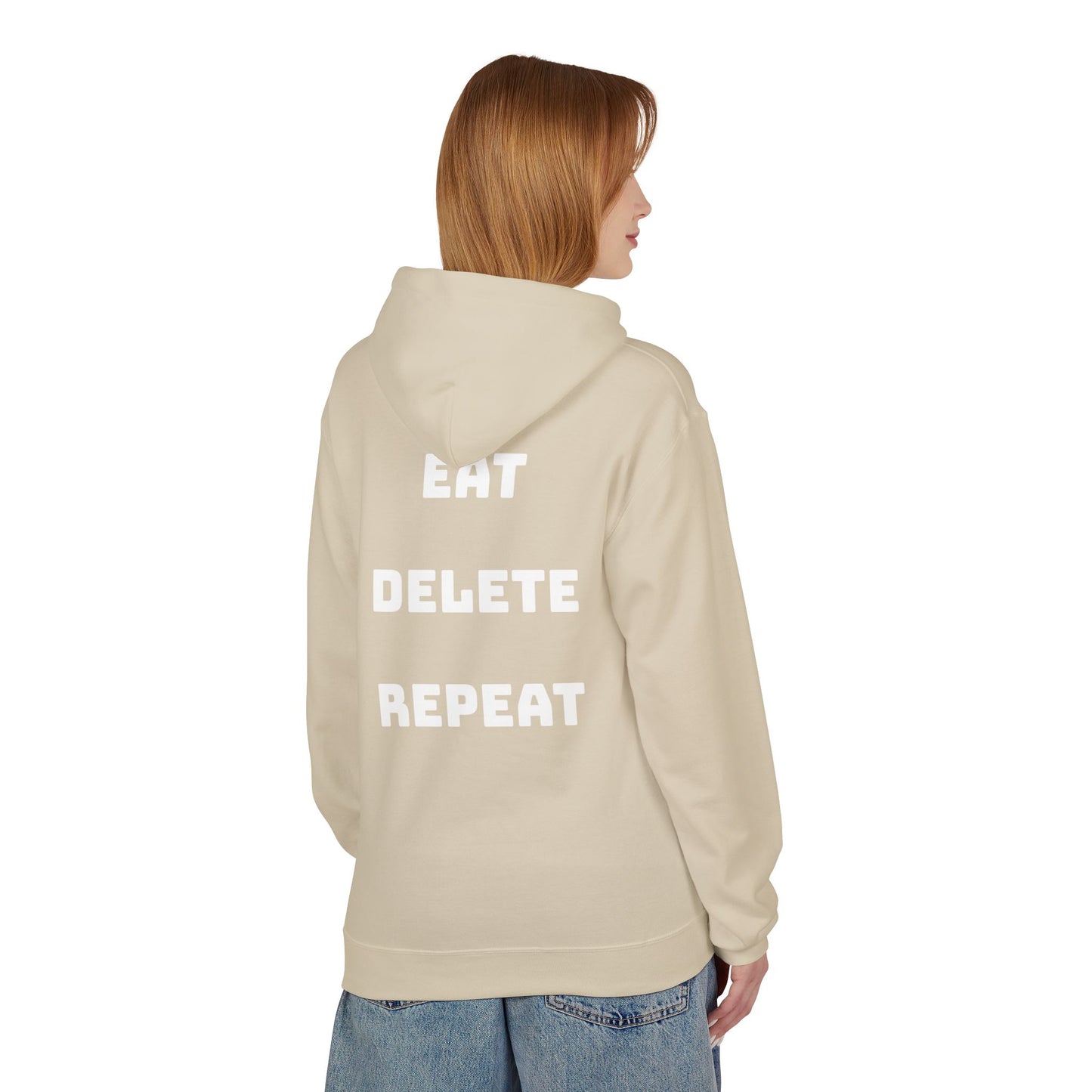 Person wearing a beige hoodie with 'EAT DELETE REPEAT' text on the back against a white background