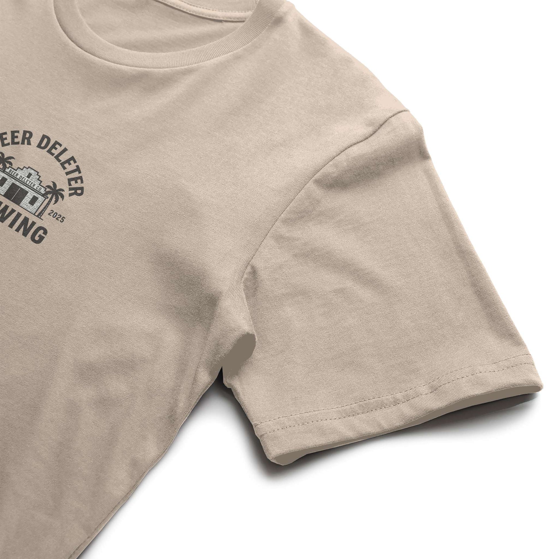 Beige t-shirt with a black graphic and text on a white background