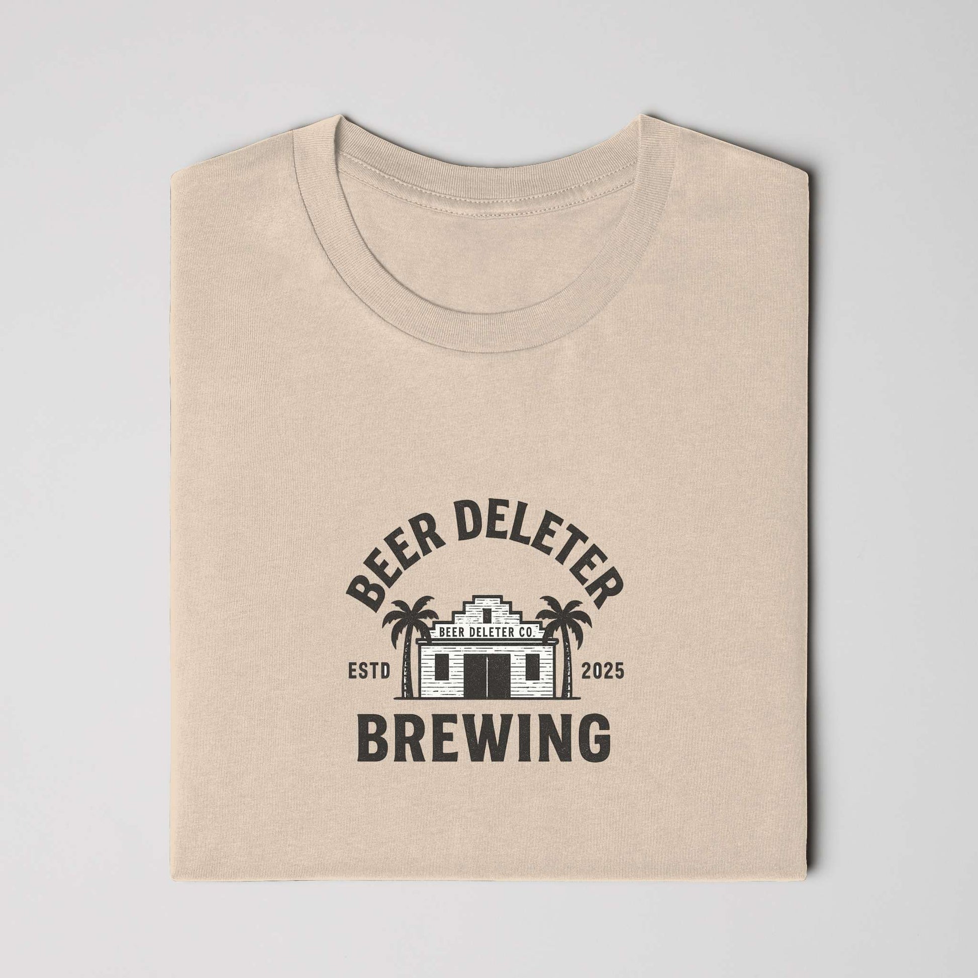Beige t-shirt folded with 'Beer Deleter Brewing' logo on a white background
