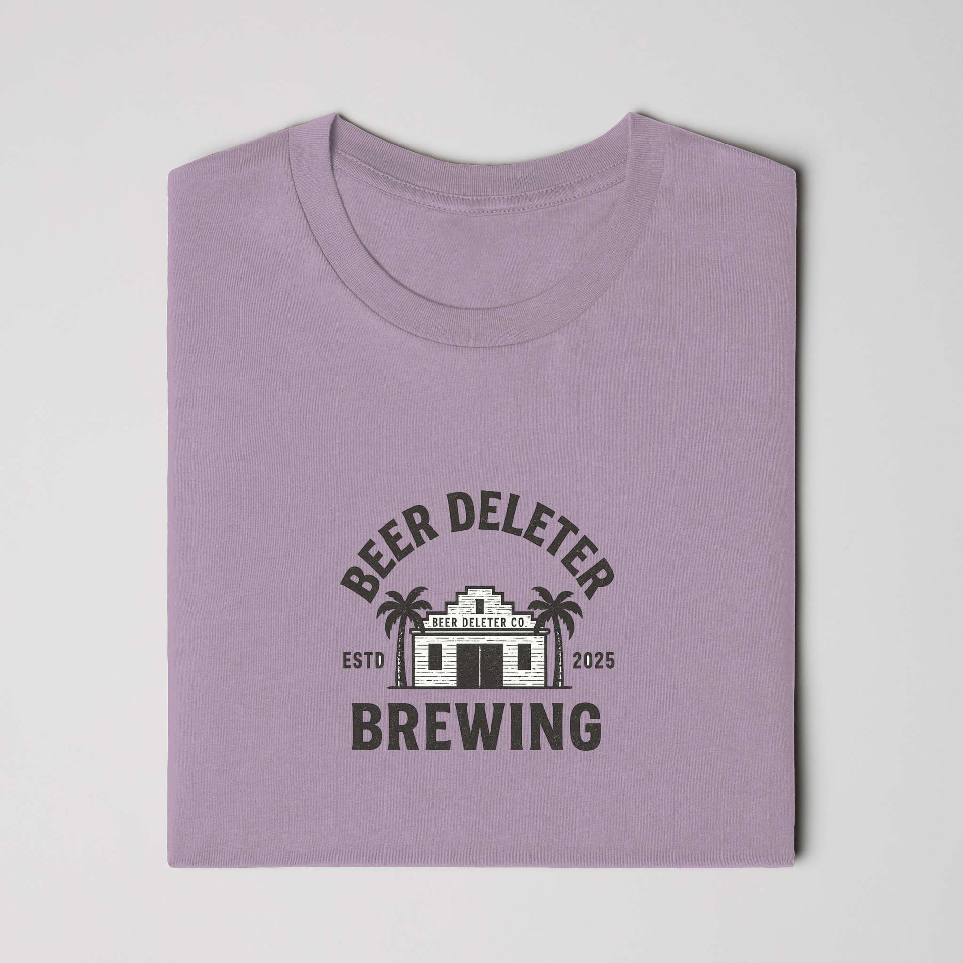 Folded purple t-shirt with 'Beer Deleter Brewing' graphic on a  white background